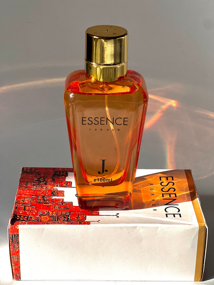 J. Essence Perfume 100ml bottle showcasing a luxurious, long-lasting fragrance for men and women.


